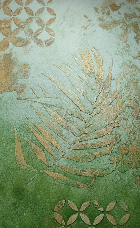 Faded green background with a golden leaf pattern and circular designs.